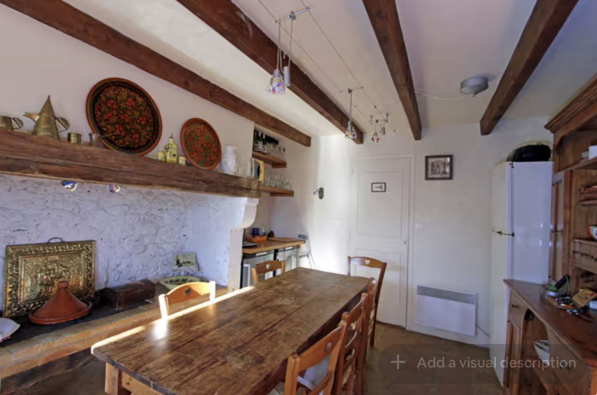 Kitchen dining table and shelving at Mongaudon
